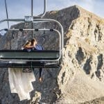 A Couple Enjoys a Ski Lift Ride After Marrying at Arapahoe Basin Ski Area